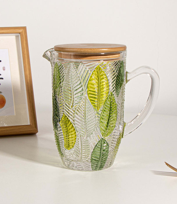 إبريق ليف زجاجي مزيّن بأوراق خضراء مع غطاء - 12.5×12.5×20 سم